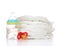 stack of diapers nipple soother and baby feeding bottle with water
