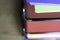 Stack of documents on brightly colored paper on stacked tray on office table