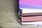 Stack of documents on brightly colored paper on stacked tray on office table