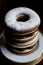 A Stack Of Donuts Sitting On Top Of A White Plate. Generative AI