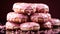 A stack of doughnuts with chocolate pink color background