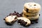 Stack of Eccles cakes on black stone background