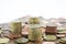 Stack of euro cents coins of different value on white background. Economy