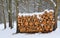 Stack of firewood covered in snow