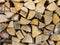 Stack of firewood, wood logs texture background.Pile of chopped fire wood prepared for winter