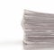 A stack of folded newspapers