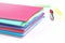 Stack of folders containing work documents in different colors