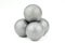 Stack of four lead musket balls on white