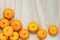 Stack of fresh mandarin oranges on wood background