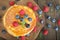 Stack of freshly baked american pancakes on wooden board