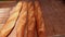 Stack of Freshly Baked Bread Baguettes in Bakery