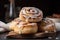 stack of freshly baked cinnamon buns, drizzled with icing and sprinkled with cinnamon