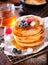 Stack of freshly baked pancakes with berries