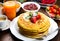 Stack of freshly prepared traditional pancakes with strawberries