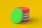 Stack of frisbee disks on yellow background