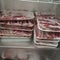 Stack of frozen sliced beef meat in frezer