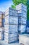 Stack fruit boxes or crates sit outside a warehouse