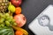 Stack of fruits and white weight scale