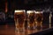 stack of glasses filled with draught beer, ready to be served at the bar