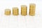 Stack of golden coins on jigsaw board. Image use for investment, business background concept