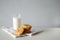 Stack of handmade oatmeal cookies with glass of milk