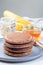 Stack of healthy oatmeal banana pancakes on  gray plate, vertical