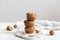 Stack of Homemade banana muffins with walnut on white background, copy space