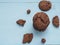 Stack homemade double chocolate chip cookies on blue wooden background.