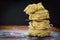 Stack of homemade nest-shaped pasta on wooden table with a copy space