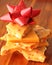 Stack of Homemade Peanut Brittle with Red Bow