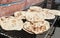 Stack of homemade pita bread for sale at a street food market, Iran. Fresh pitta flatbread