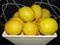 stack of imperfect lemons on black and white background