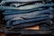 Stack of jeans fashion Background different denim layers colors