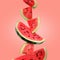 Stack of juicy watermelon slices on light coral background