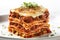 A stack of lasagna stacked on top of each other. Generative AI image.