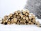 Stack of logs in different sizes artfully piled up in snowy winter scenery
