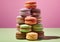 Stack of macarons dessert cream pastry on green and pink background.Macro.AI Generative