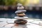 a stack of meditation stones on a patio