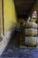 Stack of mezcal barrels on yellow wall