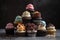 stack of mini cupcakes in assorted flavors and designs