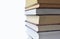 Stack of multicolored books. Old textbooks stacked on each other. Online education training skill courses concept on