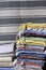 Stack of multicolored quality rugs at carpet shop, Carpets variety selection rolled up rugs shop store