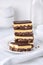 A stack of Nanaimo bars - a traditional Canadian dessert - in a white kitchen