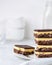 A stack of Nanaimo bars - a traditional Canadian dessert - in a white kitchen