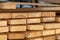 Stack of new wooden boards. Lumber. Close-up
