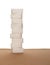 Stack of nine sugar cubes on fabric, white background. Healthy eating.
