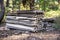 Stack of old asbestos slate roof sheets in forest