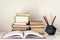 Stack of old books, textbook and pencils in office background for education concept