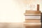 Stack old books with wooden calendar on table in sunlight morning