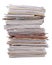 Stack of old magazines on a white
